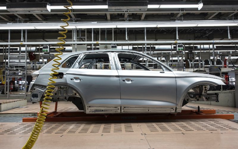a car in a factory assembly line