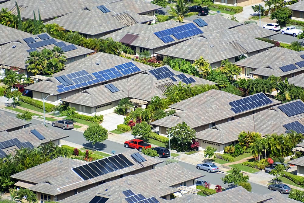 aerial view of houses with solar panels