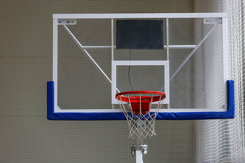 Basketball backboard on the wall in the gym