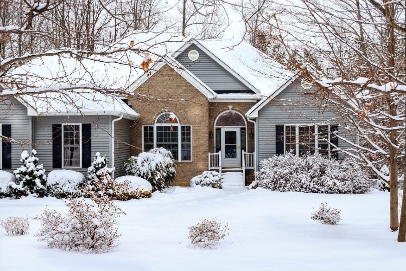beautiful house with vinyl siding during winter