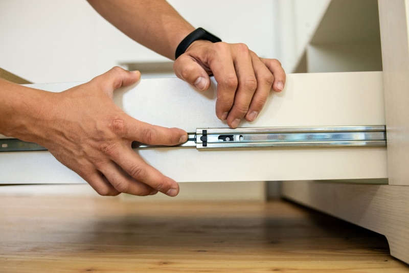 carpenter intalling drawer