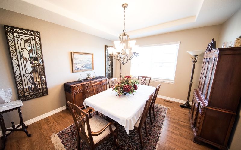 chandelier hanging over dining table