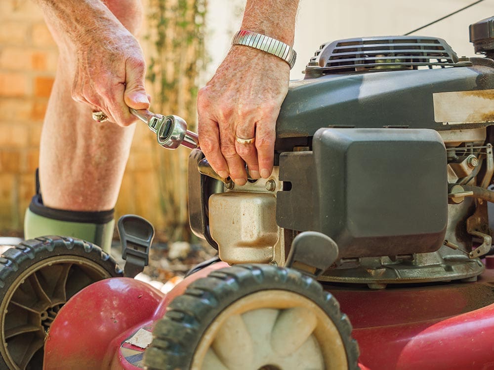 Changing lawn mower spark plug