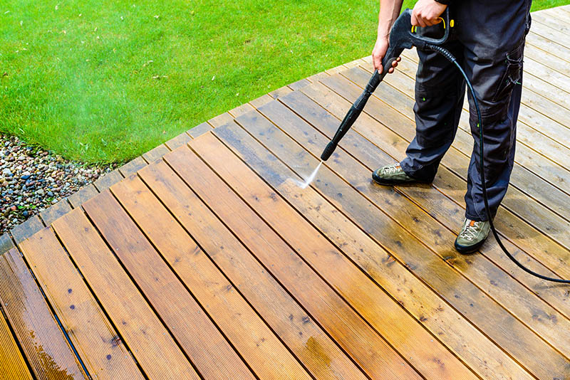 cleaning deck using pressure washer
