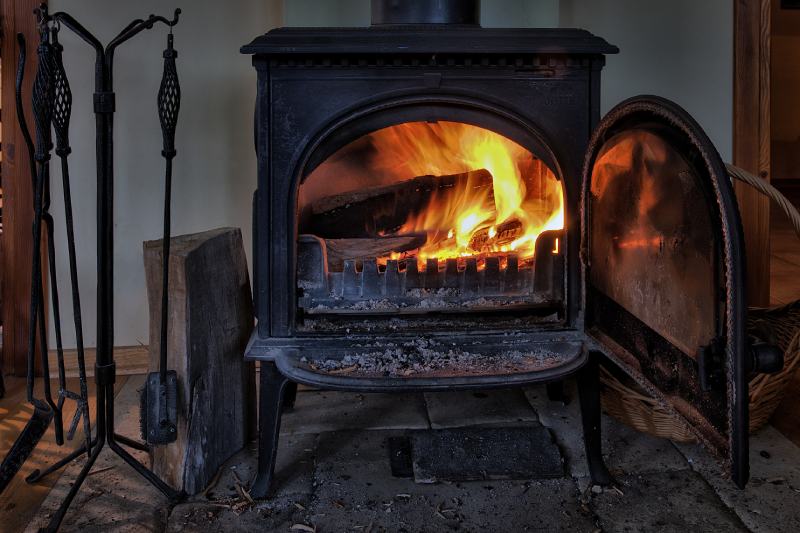 coal stove fireplace with burning wood