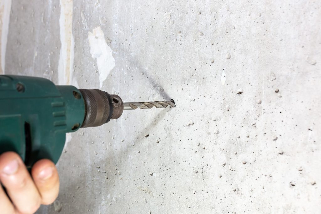 drilling in the concrete wall