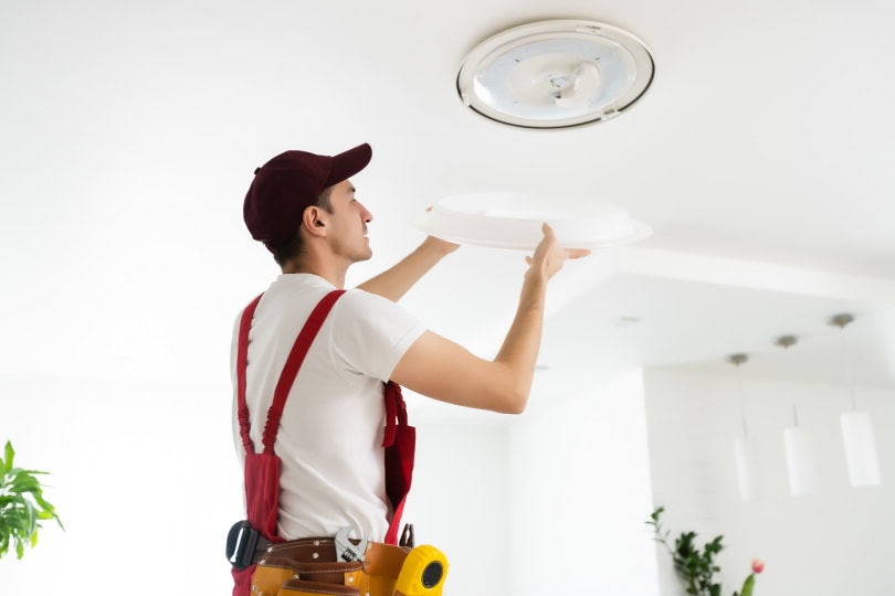 electrician fixing light