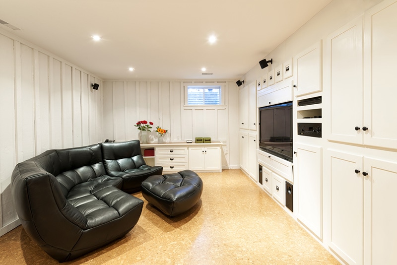 Finished basement of residential home with entertainment center