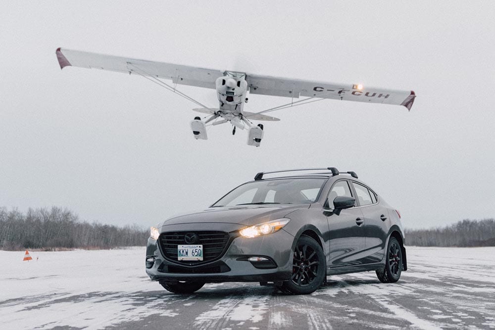 grey Mazda3 on runway