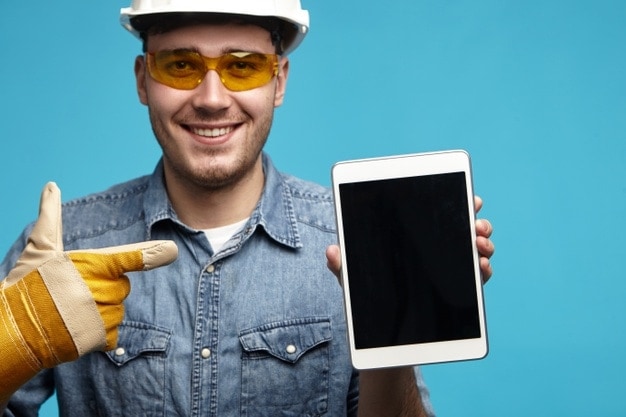 handyman holding an ipad