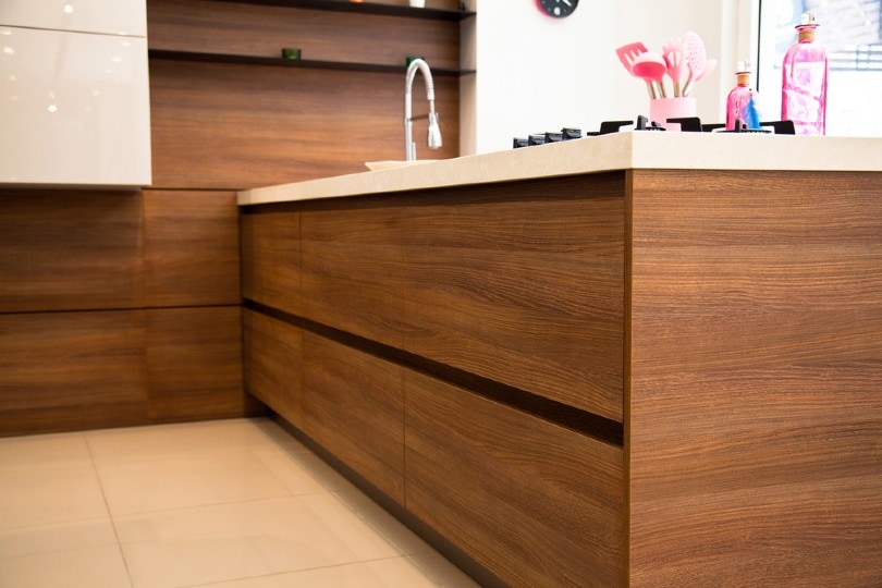 kitchen cabinets made out of walnut wood