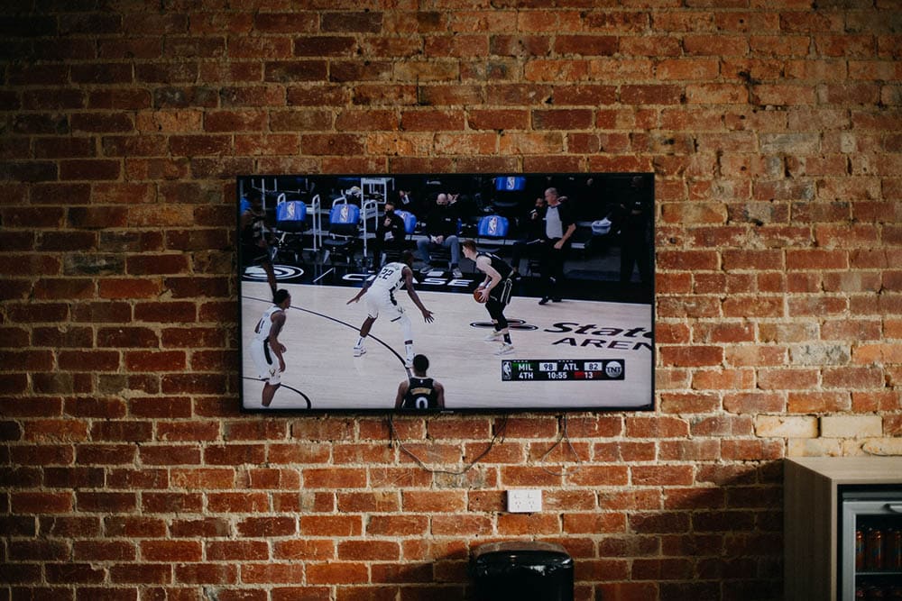 living room with brick wall