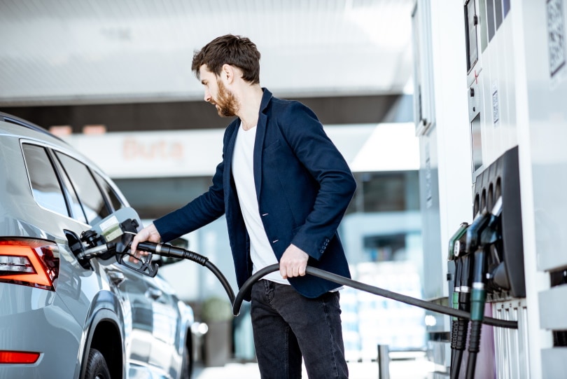 man refueling his car