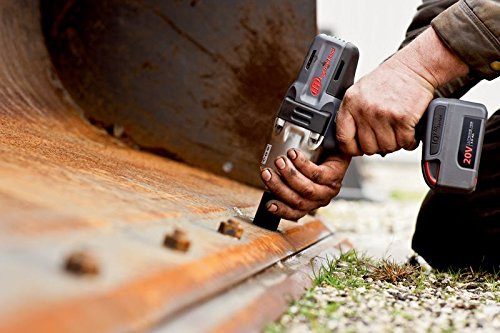 man repairing rusty metal