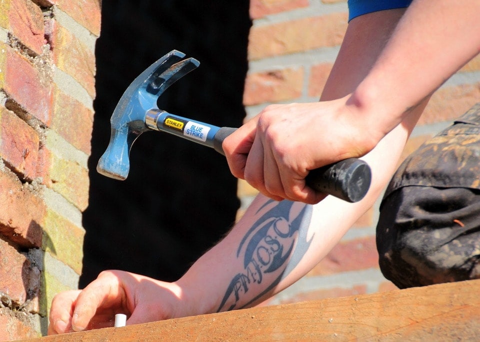 man using a hammer