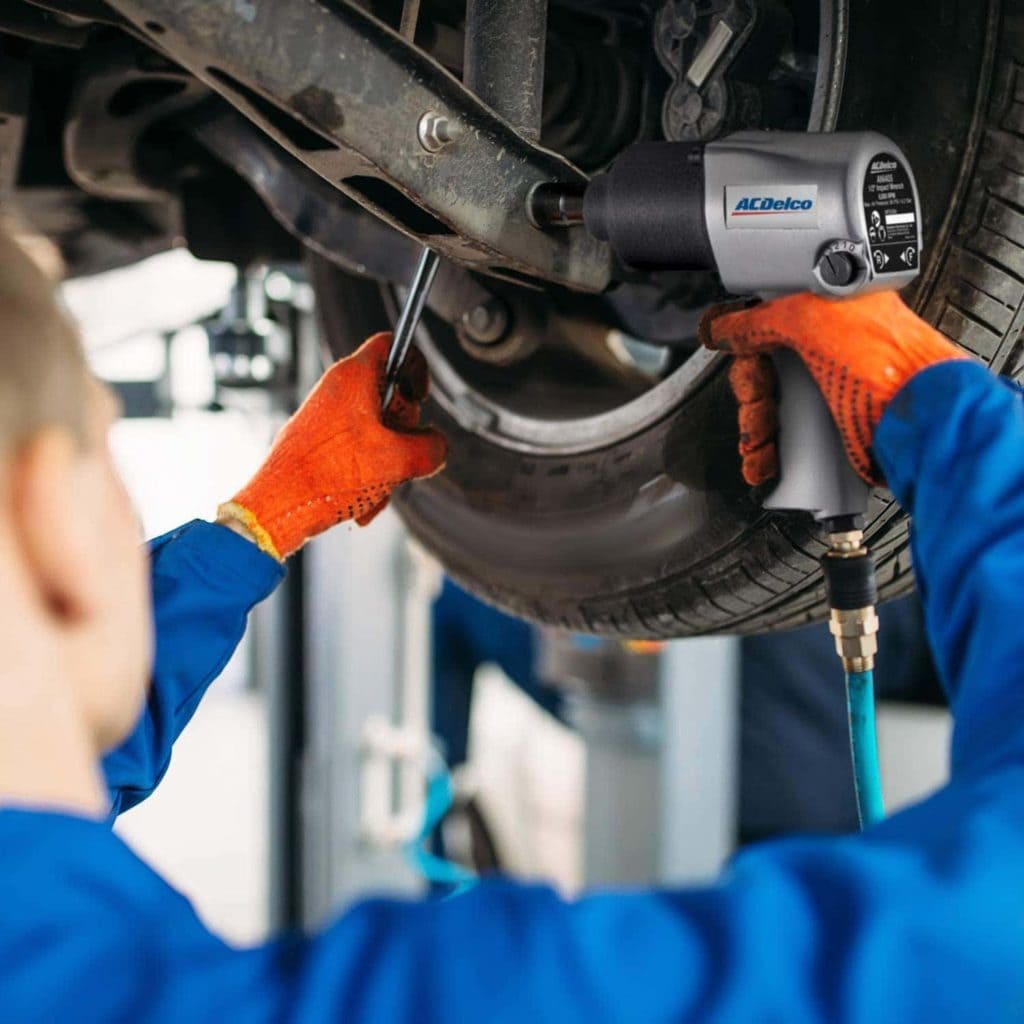 man using ACDelco ANI405A Pneumatic Impact Wrench