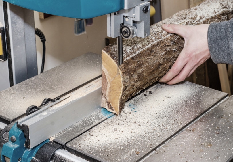 man using band saw