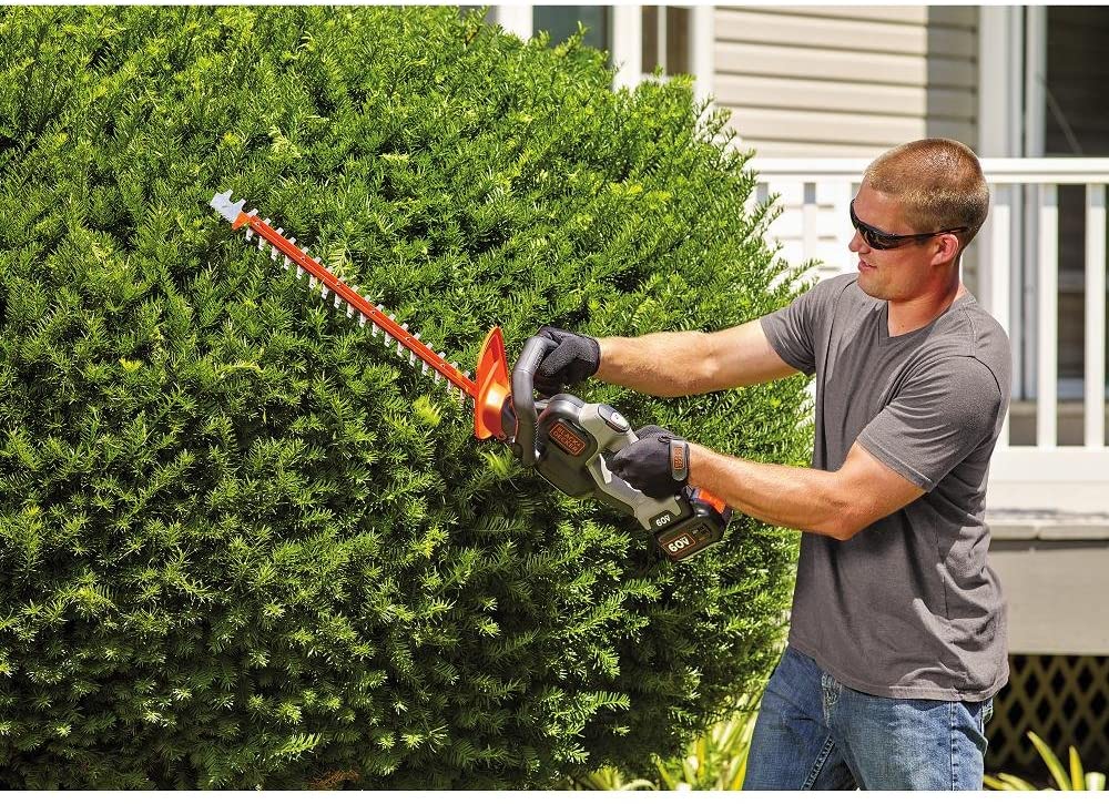 man using BLACK+DECKER LHT360CFF Cordless Hedge Trimmer