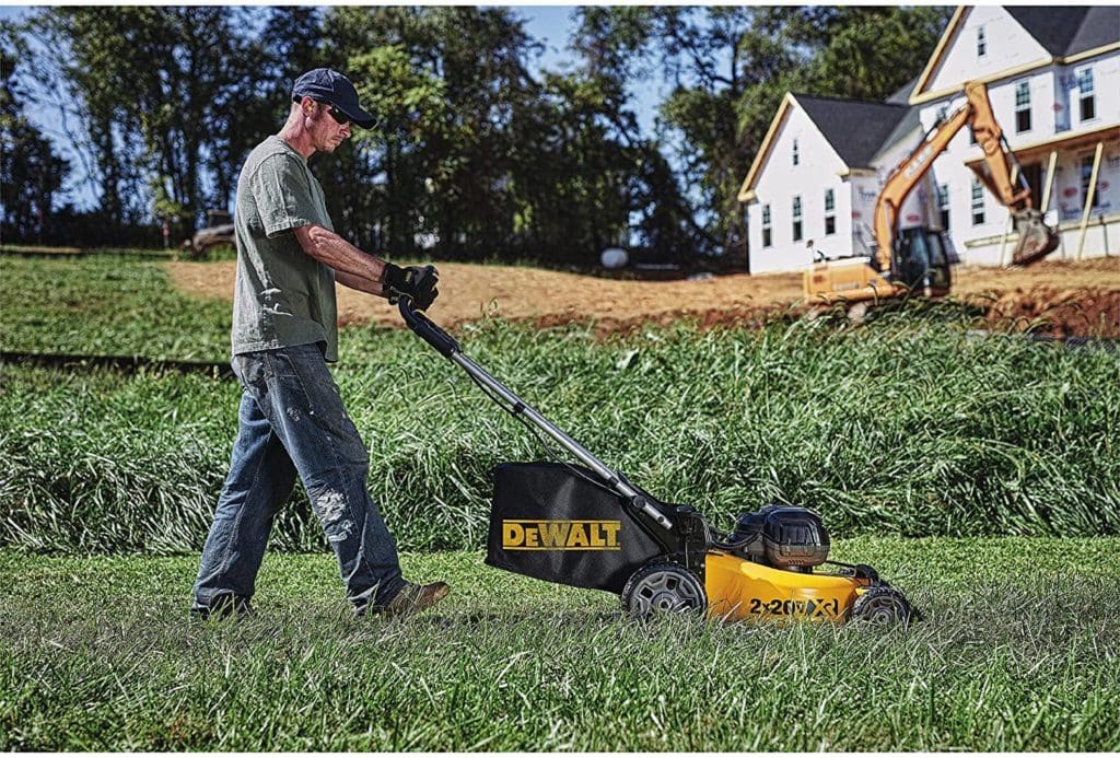 man using DEWALT DCMW220P2 Lawn Mower