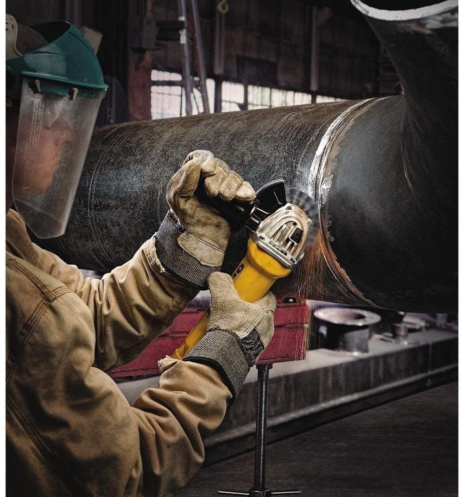 man using DEWALT DWE402 Angle Grinder Tool