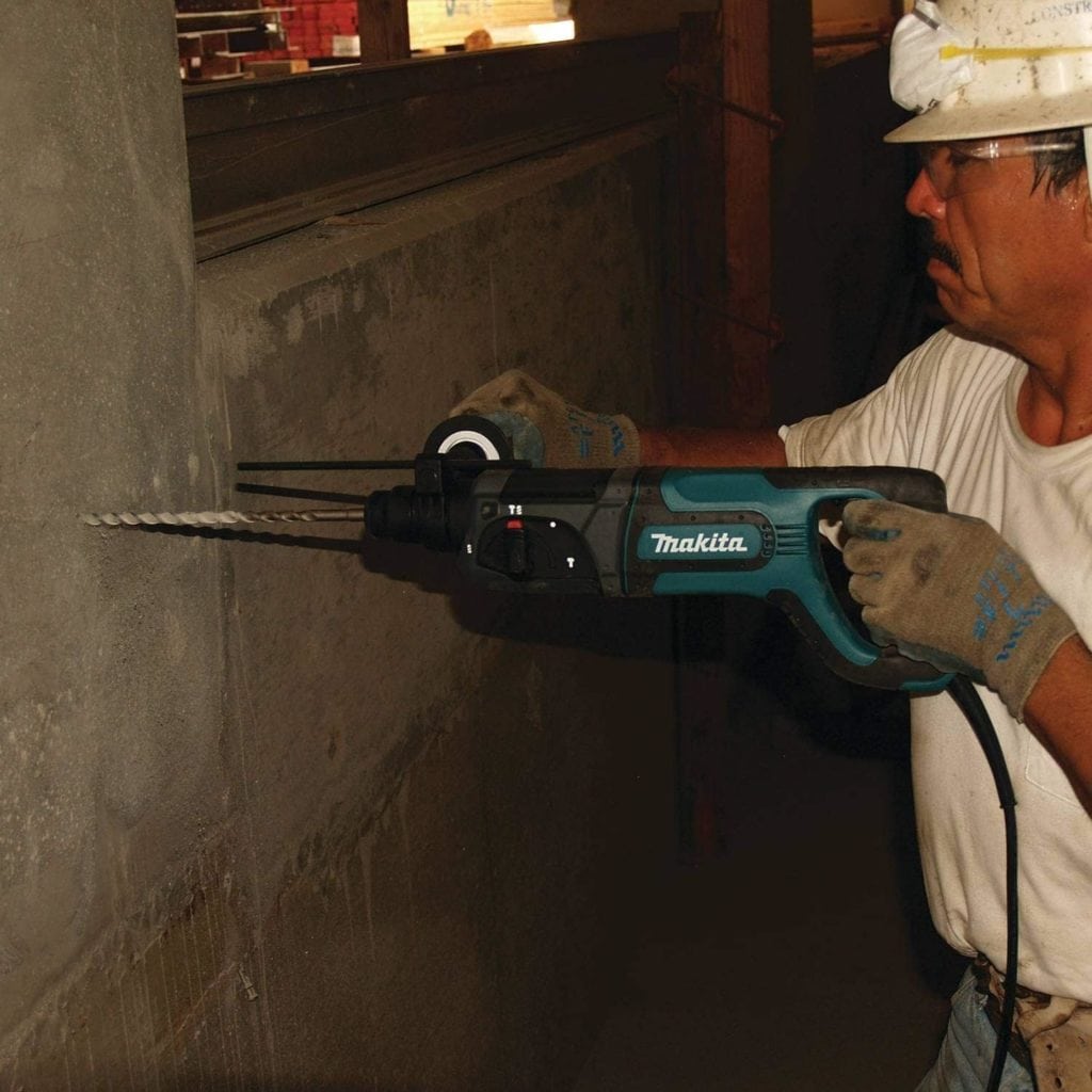 man using Makita HR2475 Rotary Hammer