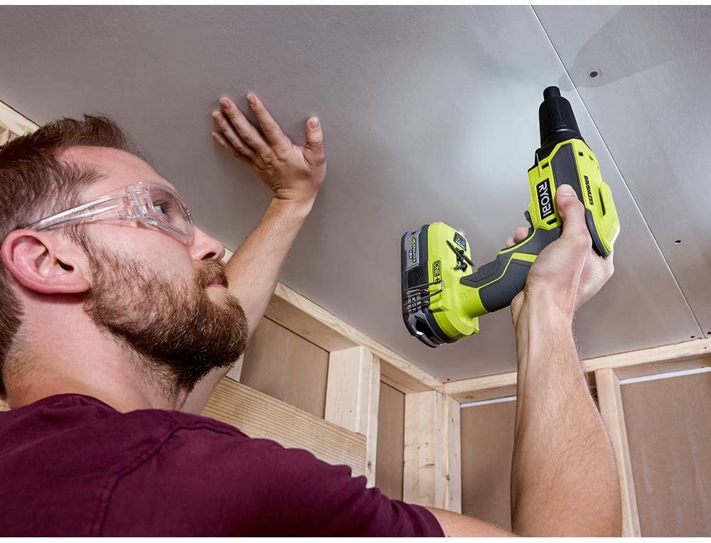 man using Ryobi 18-Volt ONE+ Brushless Drywall Screw Gun