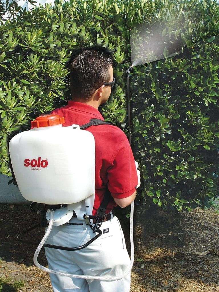 man using Solo 475-B Diaphragm Pump Backpack Sprayer