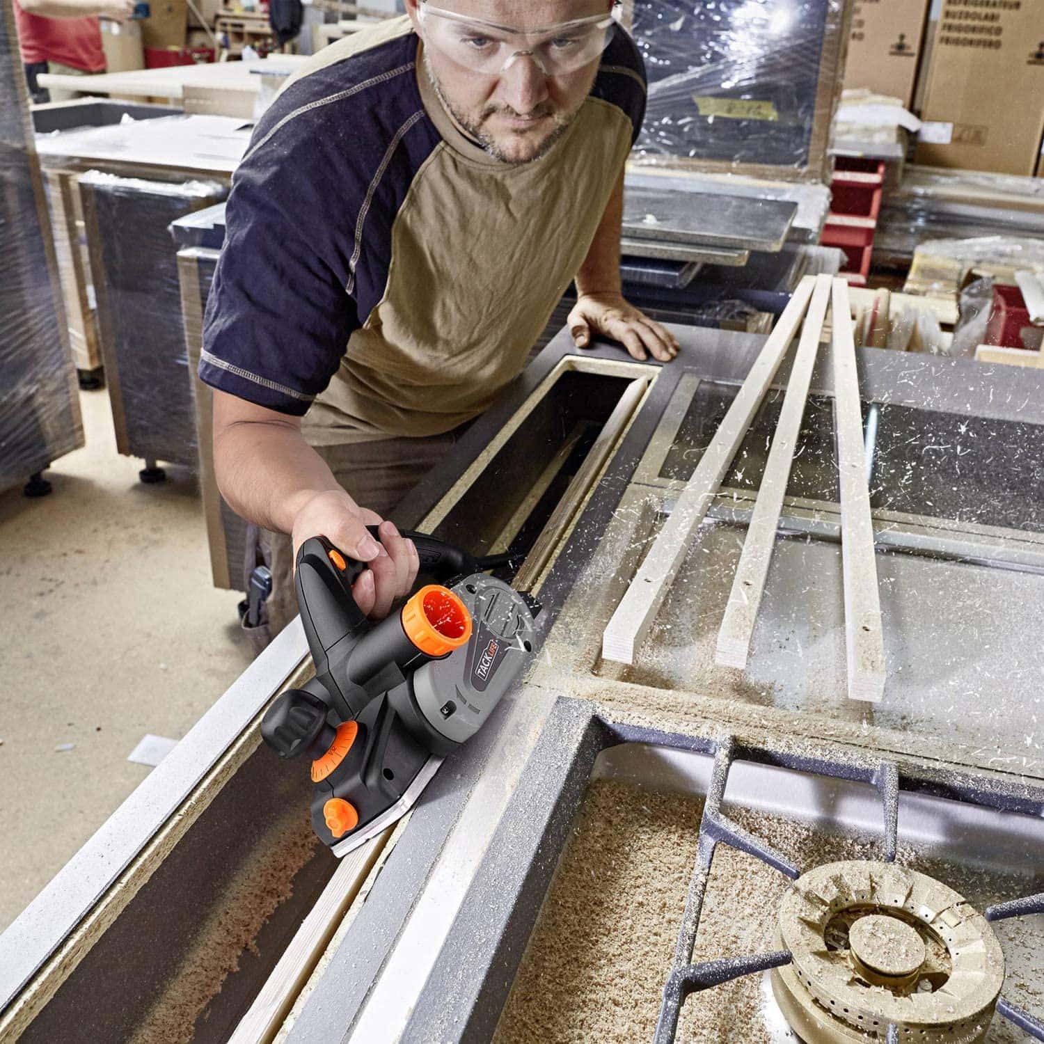 man using TACKLIFE TGGLA152 Electric Hand Planer