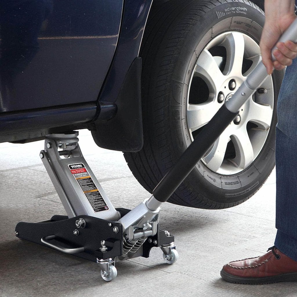 man using Torin TAM815016L Aluminum Floor Jack
