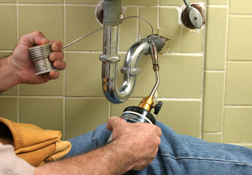 man using welding torch