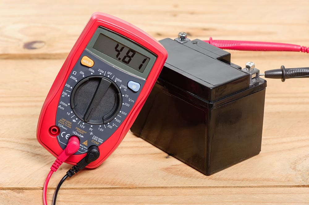 multimeter checking motorcycle battery
