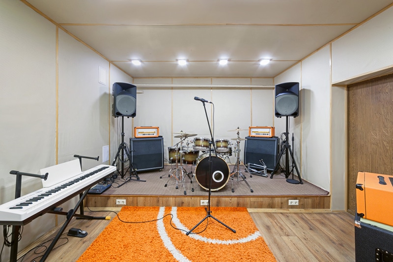 Music rehearsal space with drum kit and musical equipment
