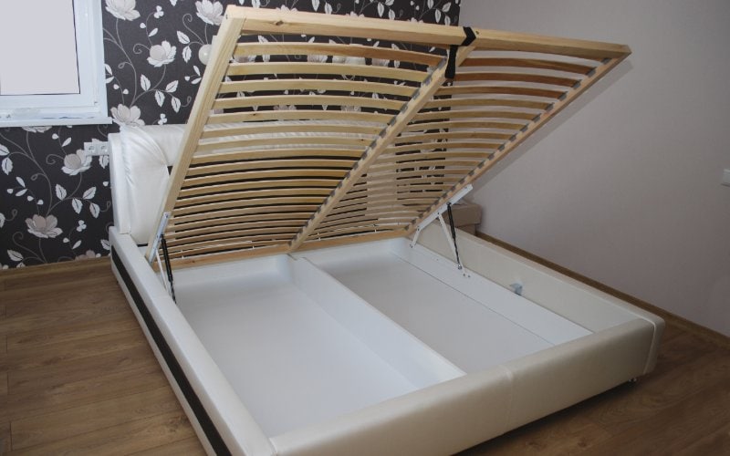 ottoman bed with the slats lifted to open the storage beneath