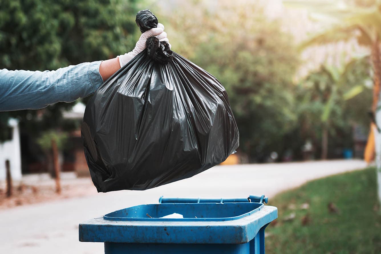 person disposing garbage