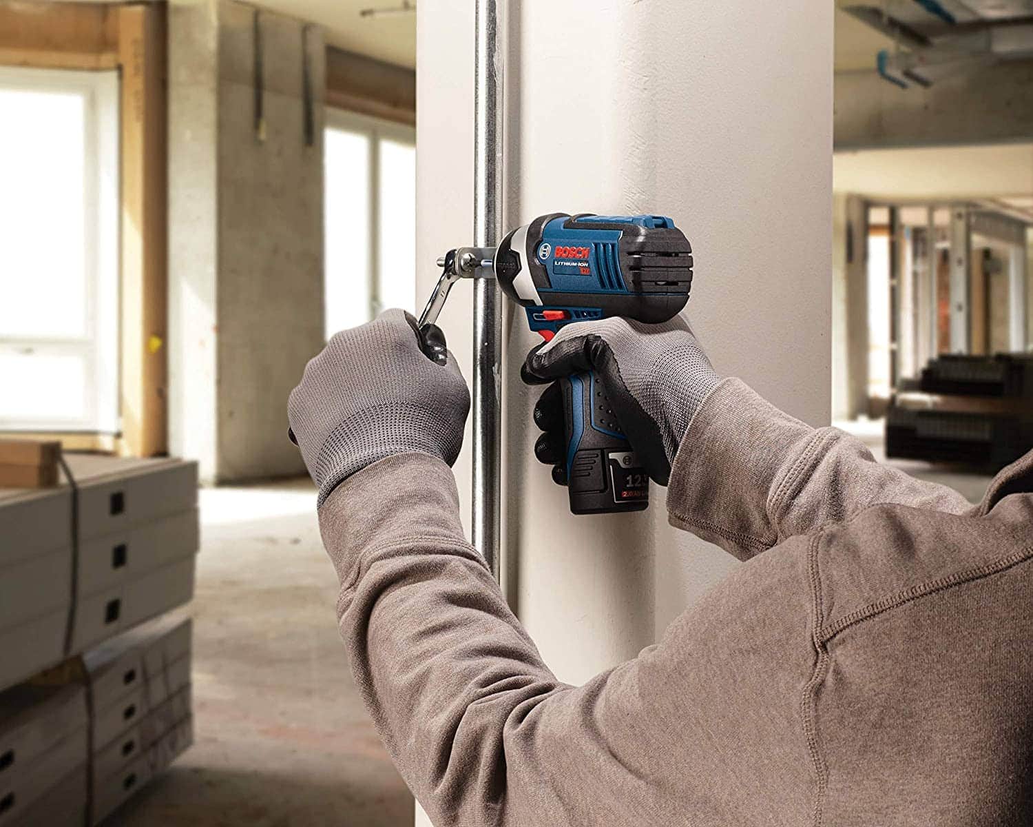 person using Bosch Power Tool
