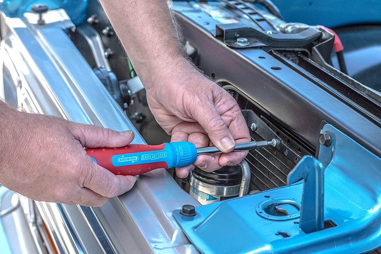 person using Channellock 131CB 13-in-1 Ratcheting Screwdriver