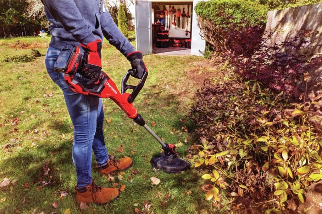 person using CRAFTSMAN CMCST900D1 WEEDWACKER