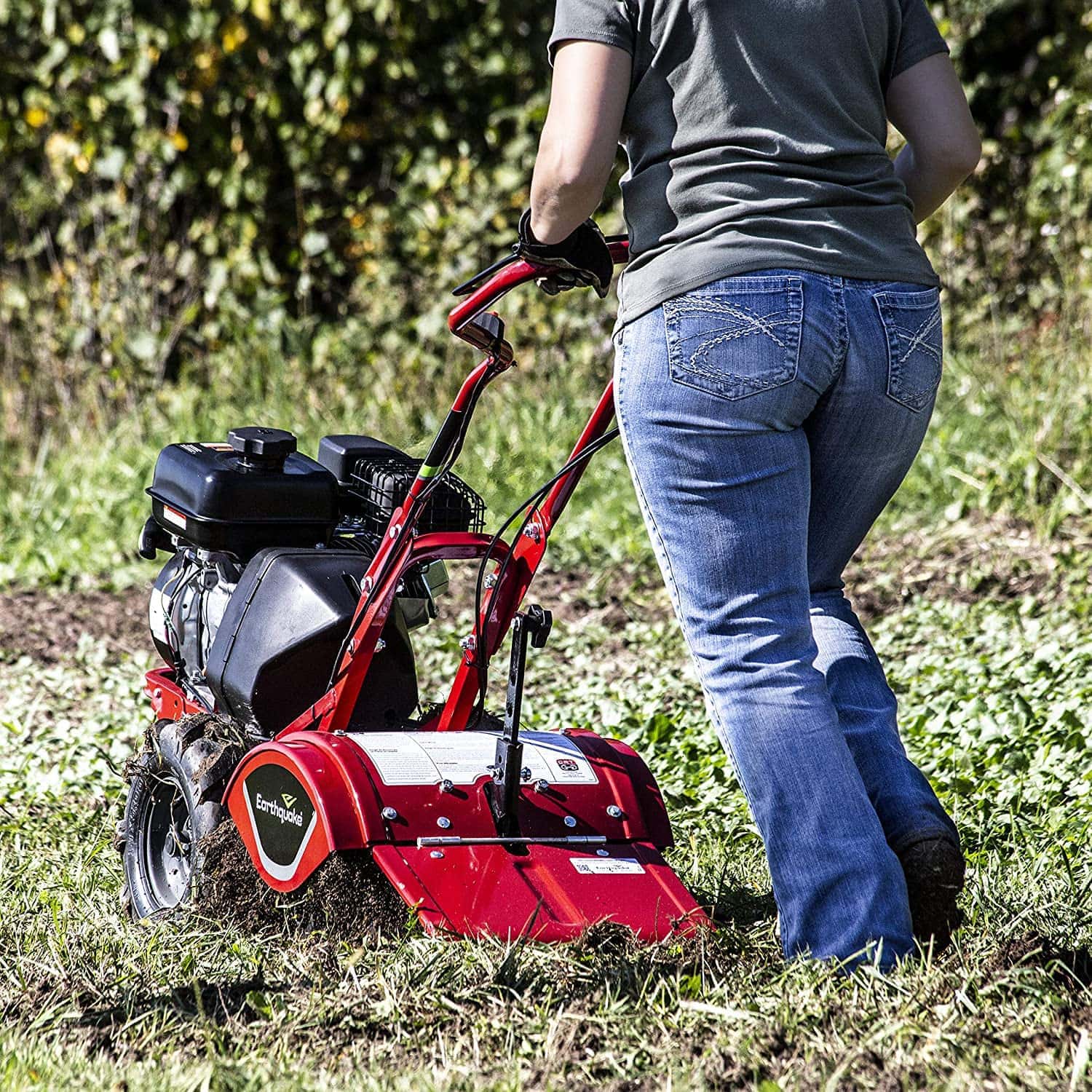 person using EARTHQUAKE 33970 Victory Rear Tine Tiller