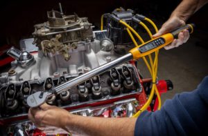 person using GEARWRENCH 85077 Drive Electronic Torque Wrench