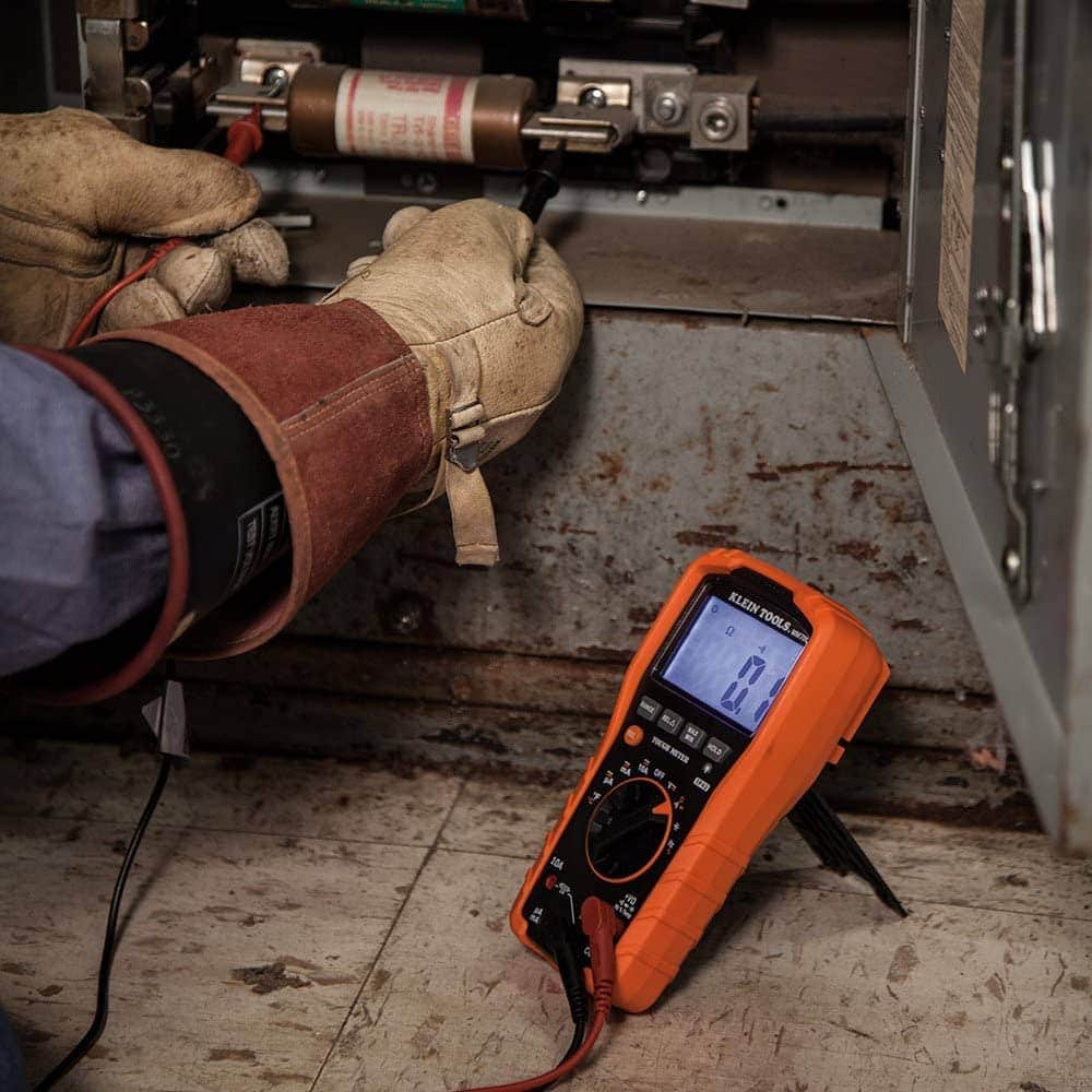 person using Klein Tools MM700 Multimeter
