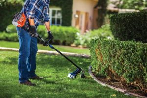 person using Remington RM2560 Rustler String Trimmer