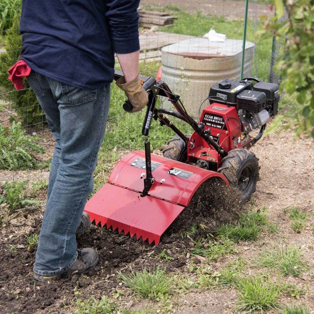 person using Southland SRTT212 Rear Tine Rotary Tiller