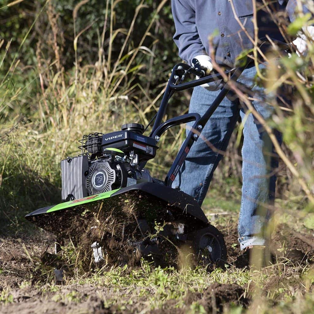 person using Tazz 35310 2-in-1 Front Tine Tiller