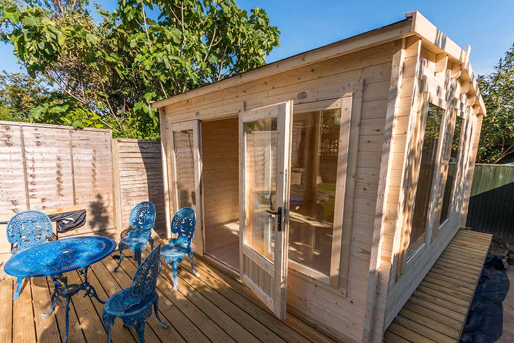 Timber studio shed with blue iron seating