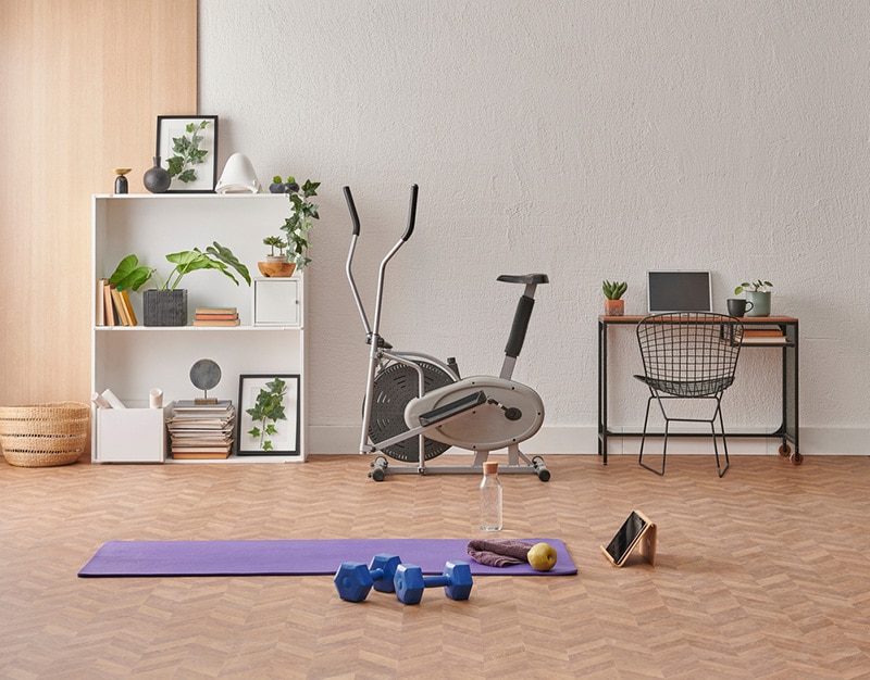 Training at home concept, interior, decorative sport in the room with gym fitness exercise purple mat