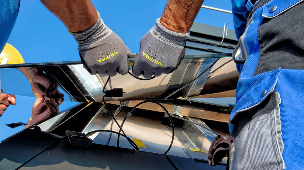 two men installing solar panels