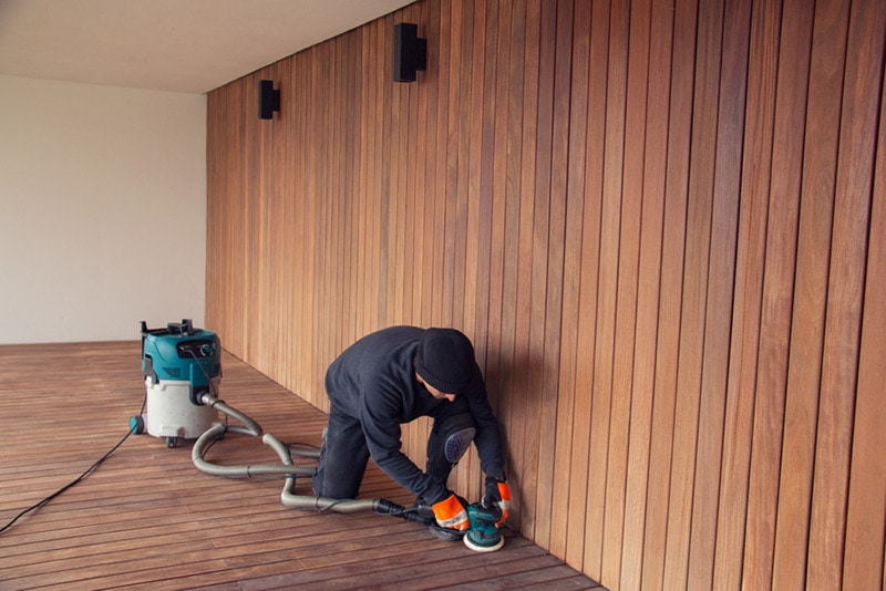 vacuuming sanding deck