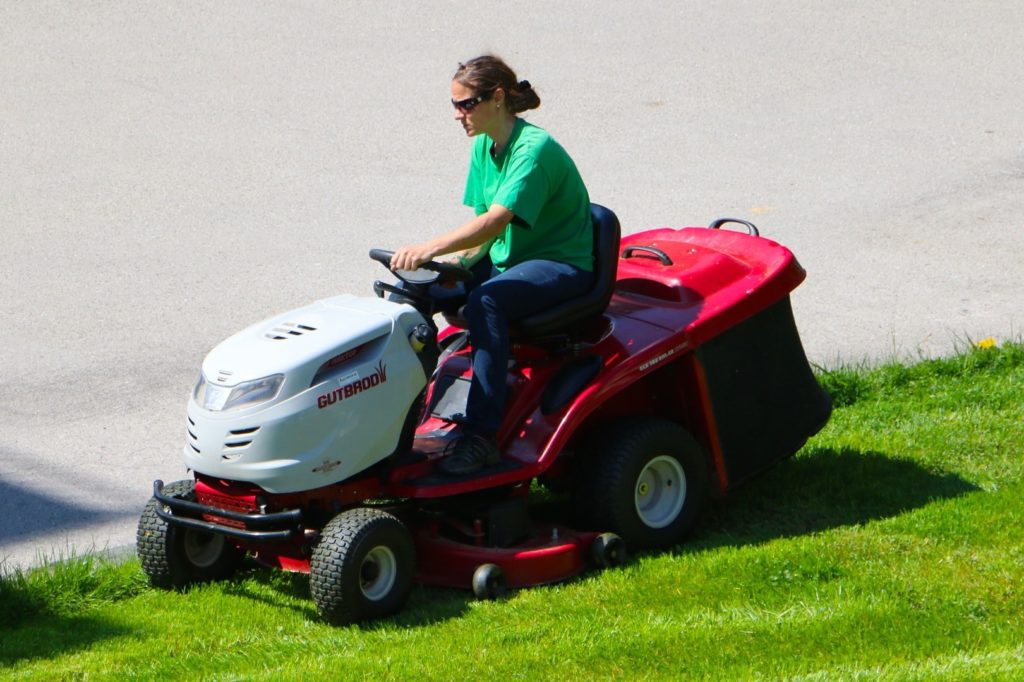 woman in riding mower