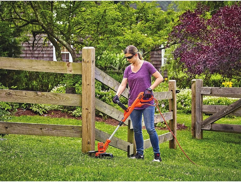 woman using BLACK+DECKER GH900 String Trimmer