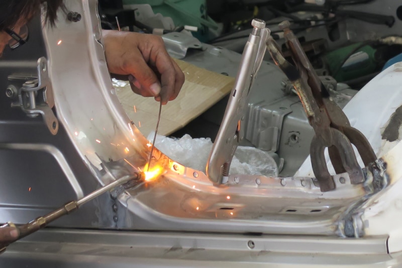 worker working on car body